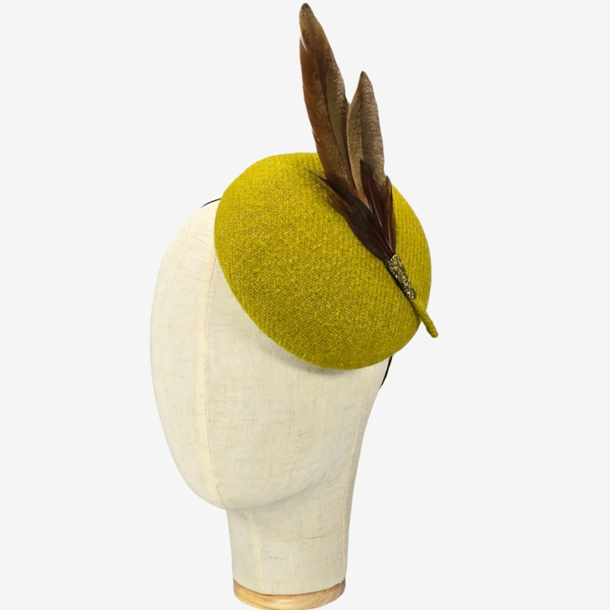Chartreuse Harris tweed pillbox hat with pheasant feathers