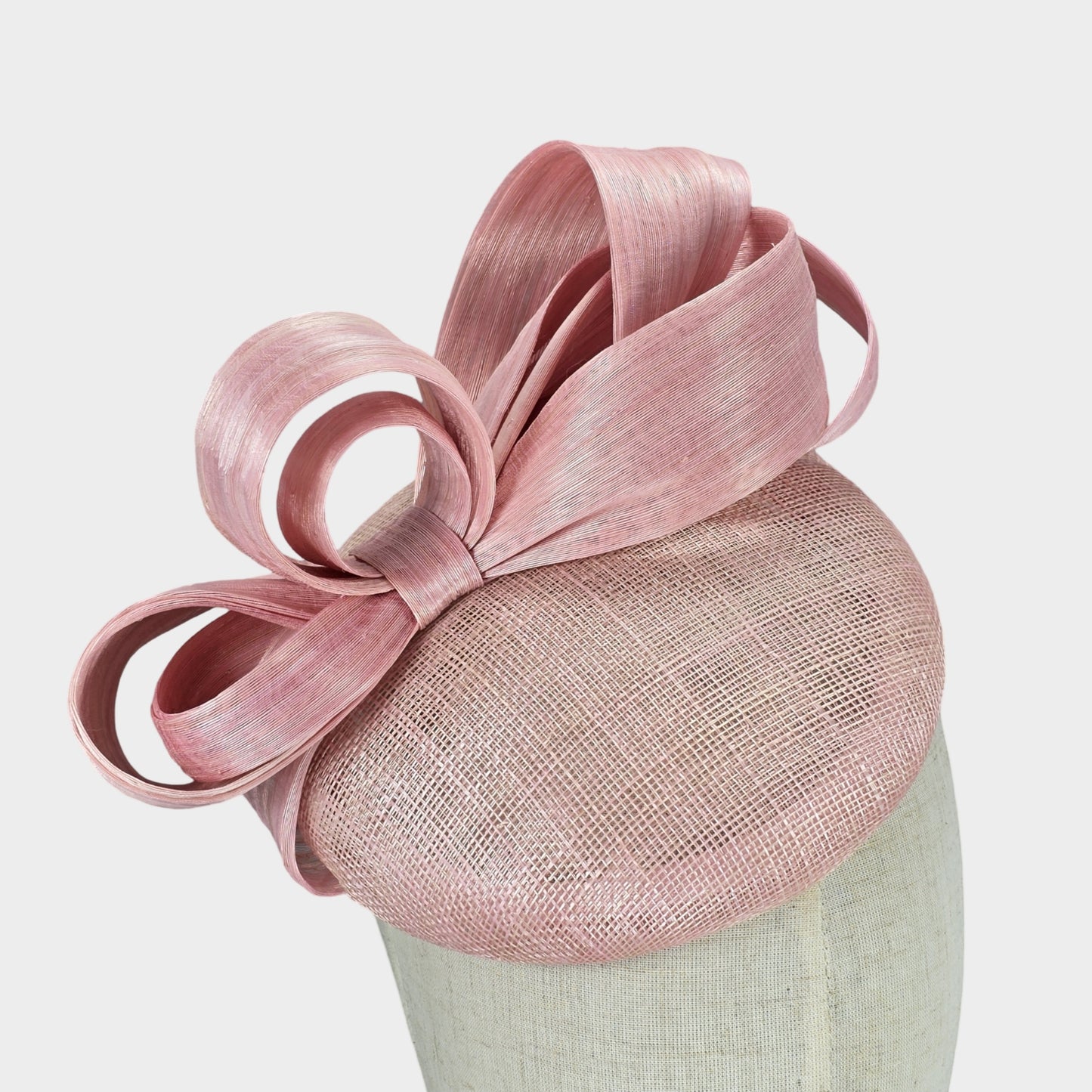 Pale pink sinamay pillbox hat with abaca silk bow