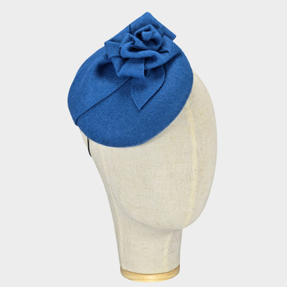 Blue felt button shaped pillbox hat