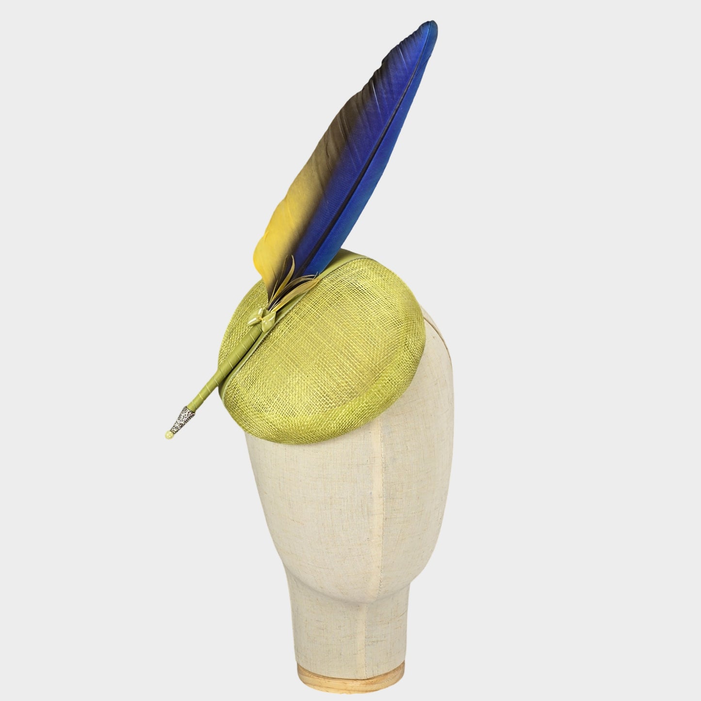 Chartreuse pillbox hat with blue Macaw feather