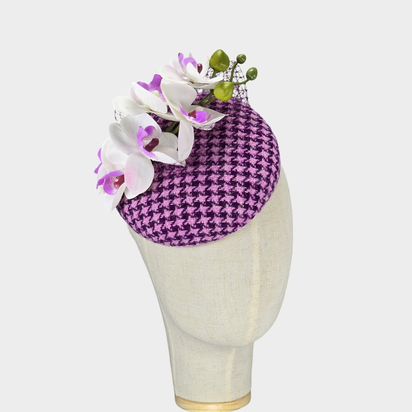 pink and purple pillbox fascinator with orchid flowers
