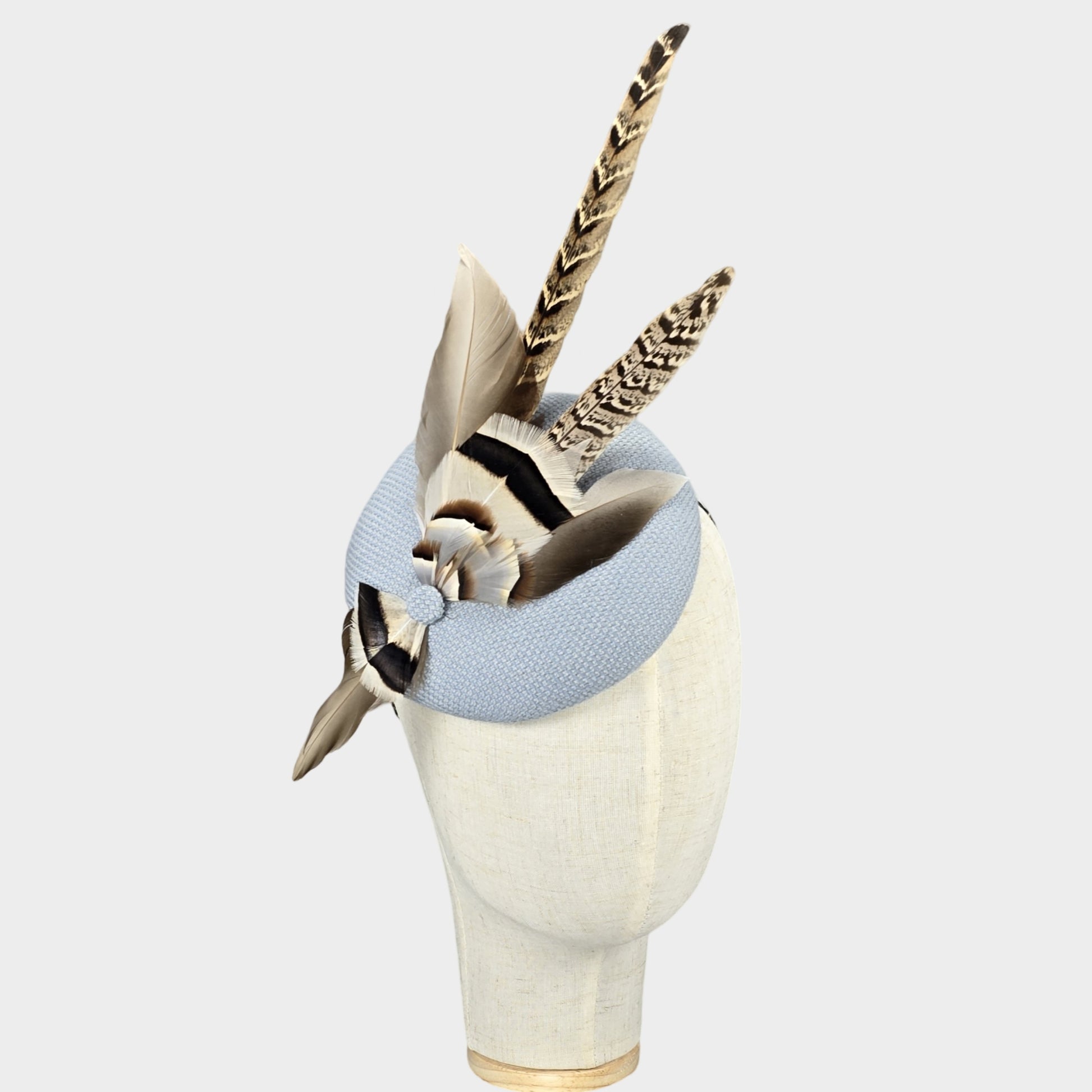 Light blue pillbox hat with pheasant feathers
