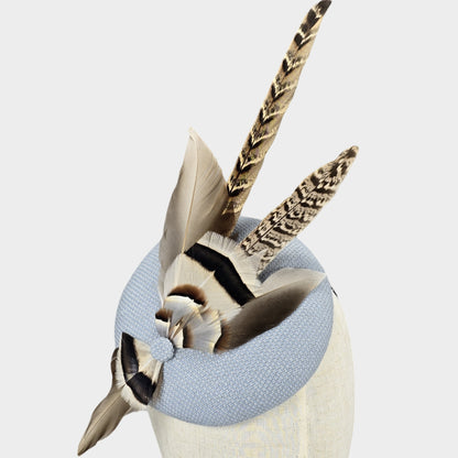 Pale blue pillbox hat with pheasant feathers