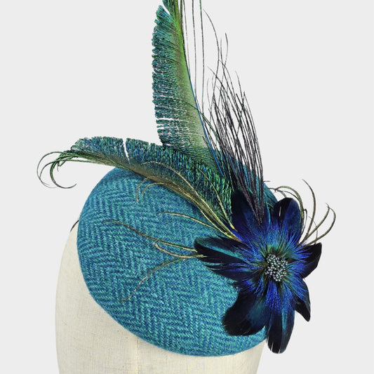 Turquoise Harris Tweed pillbox hat with feather flower Liskin millinery studio